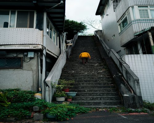 A person climbing stairs in a residential building